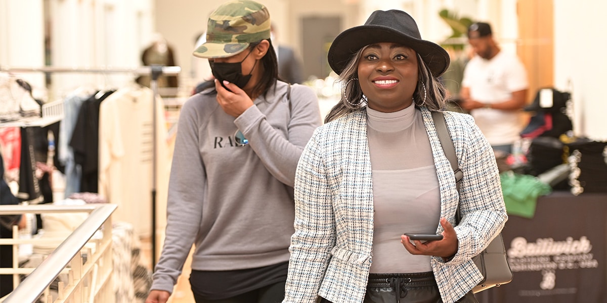 Photography of Black women shopping at a small business